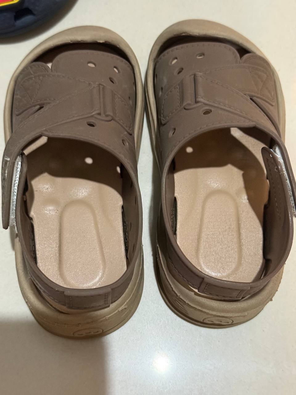 Two pairs of children's shoes, brown and C8 Crocs